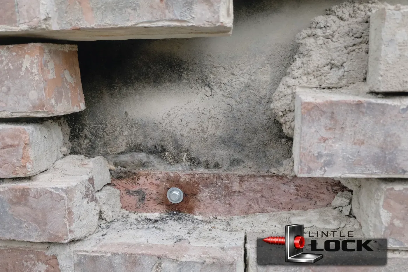 Exposed brick wall above garage door with LintleLOCK™ system (LintleLOCK™ logo watermark)
