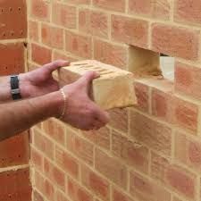 Technician performing professional brick replacement