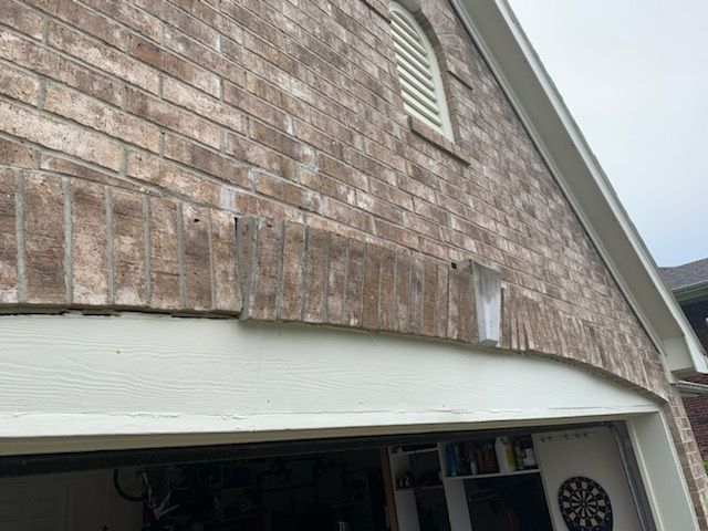 Sagging brick arch and failing lintel support